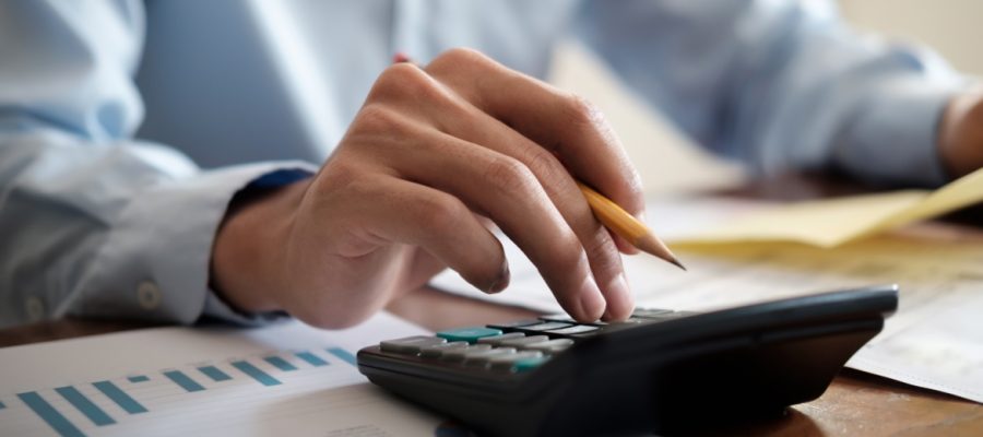 Finances Saving Economy and Investment concept. Accountant or banker use calculator.